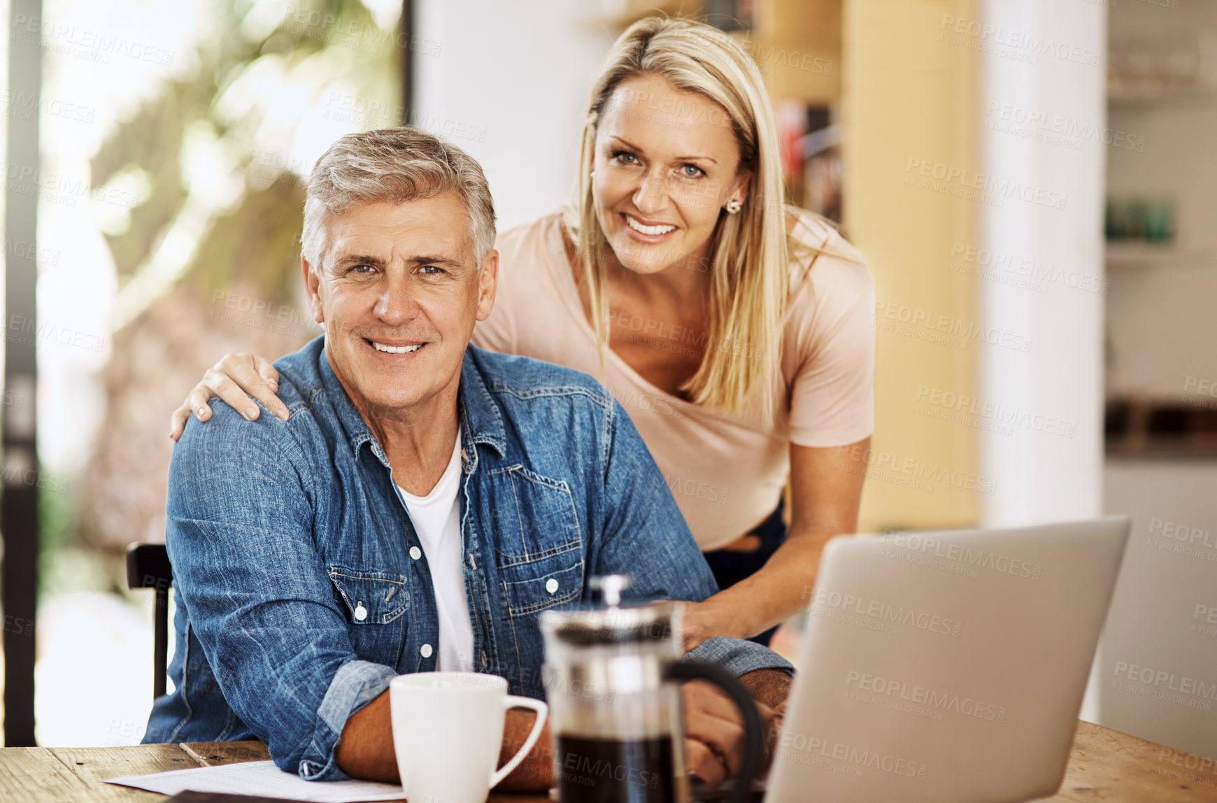 Buy stock photo Mature couple, smile and laptop in kitchen for planning, financial strategy for future goal. Table, man and woman together in portrait for retirement budget, happiness with economy for home mortgage