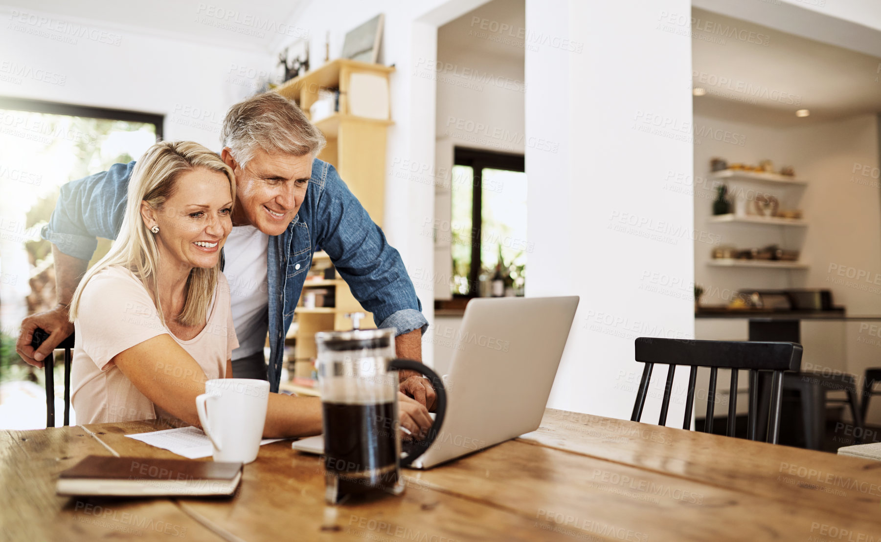 Buy stock photo Cropped shot of a mature couple using a laptop together