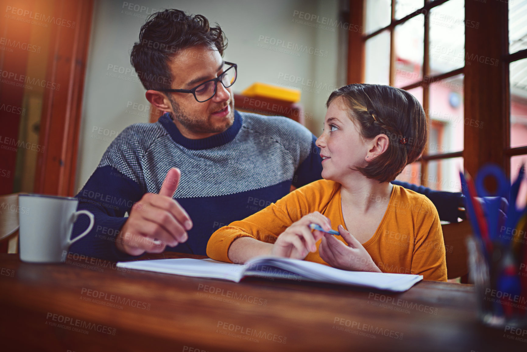 Buy stock photo Homework, education and dad helping child with studying for private school admission exam. Scholarship, learning and father with girl kid student reading, writing and preparing for test in house.