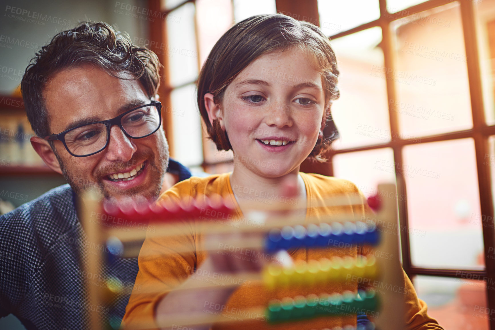 Buy stock photo Smile, man and kid with abacus for homeschool, learning and lesson in living room. Help, dad and daughter at home for teaching, support and knowledge with tools for numbers, education and count