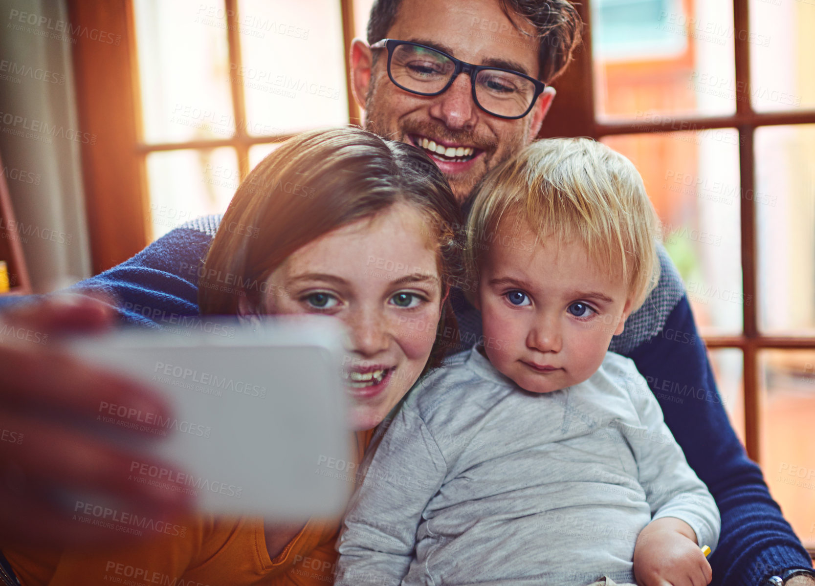 Buy stock photo Dad, baby and girl with selfie in home with smile, memory and siblings for post on social media. Man, father and children with photography, happy and profile picture with mobile app in family house