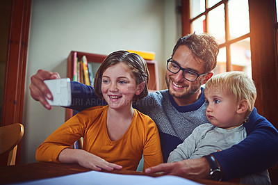 Buy stock photo Father, baby and girl with selfie in home with smile, memory and siblings for post on social media. Man, dad and children with photography, happy and profile picture with mobile app in family house