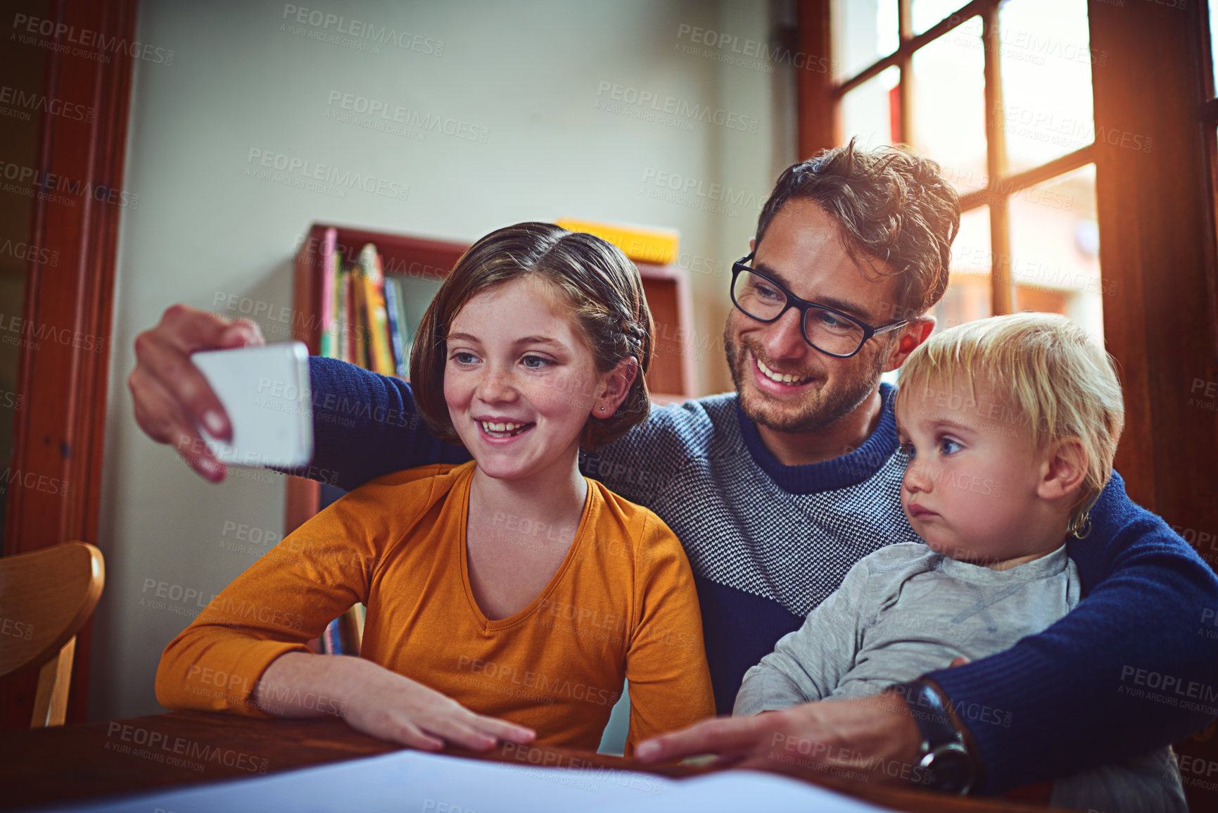 Buy stock photo Father, baby and girl with selfie in home with smile, memory and siblings for post on social media. Man, dad and children with photography, happy and profile picture with mobile app in family house