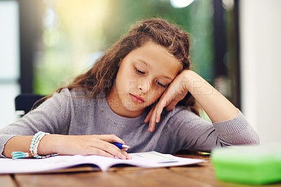 Buy stock photo Cropped shot of a young girl doing homework inside