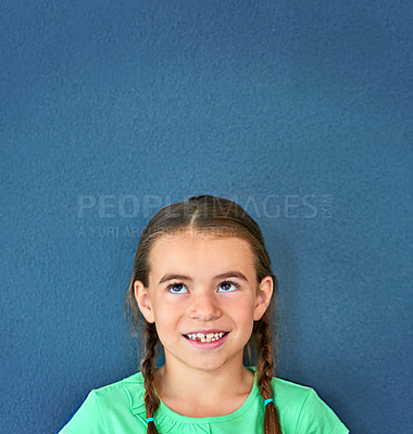 Buy stock photo Girl, child and smile with thinking on mockup with question, imagination and curiosity on blue background. Person, uncertain kid and thoughtful with wondering, daydreaming and contemplating on space