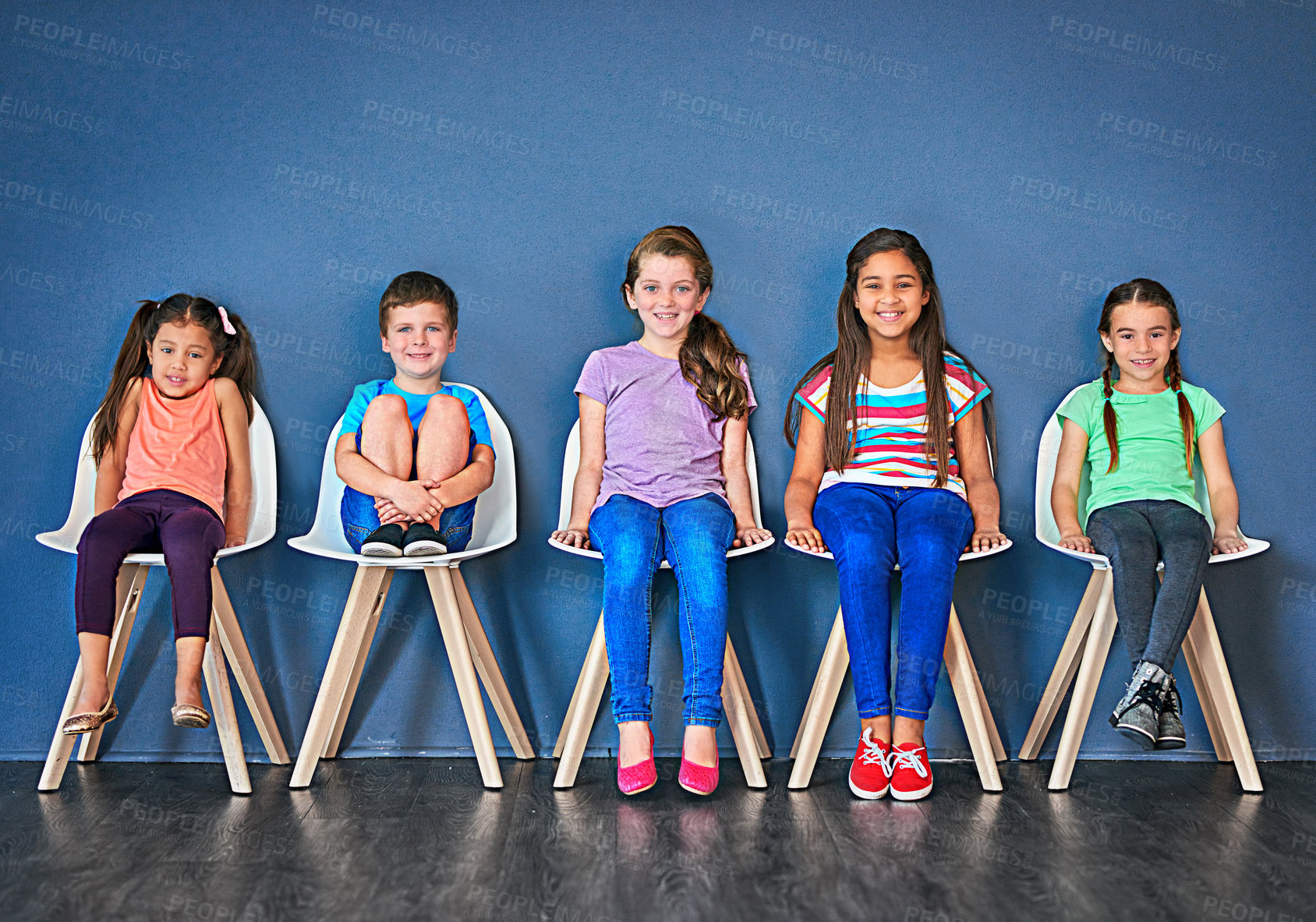 Buy stock photo Kids, row and chair with portrait in studio for development, knowledge or learning in school together. Happy, children and students with smile at academy for scholarship, education or academic growth