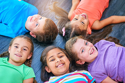 Buy stock photo Above, circle and portrait of kids on floor for playing, friendship and bonding in classroom. Diversity, youth and group of children with smile for learning, education and development at school