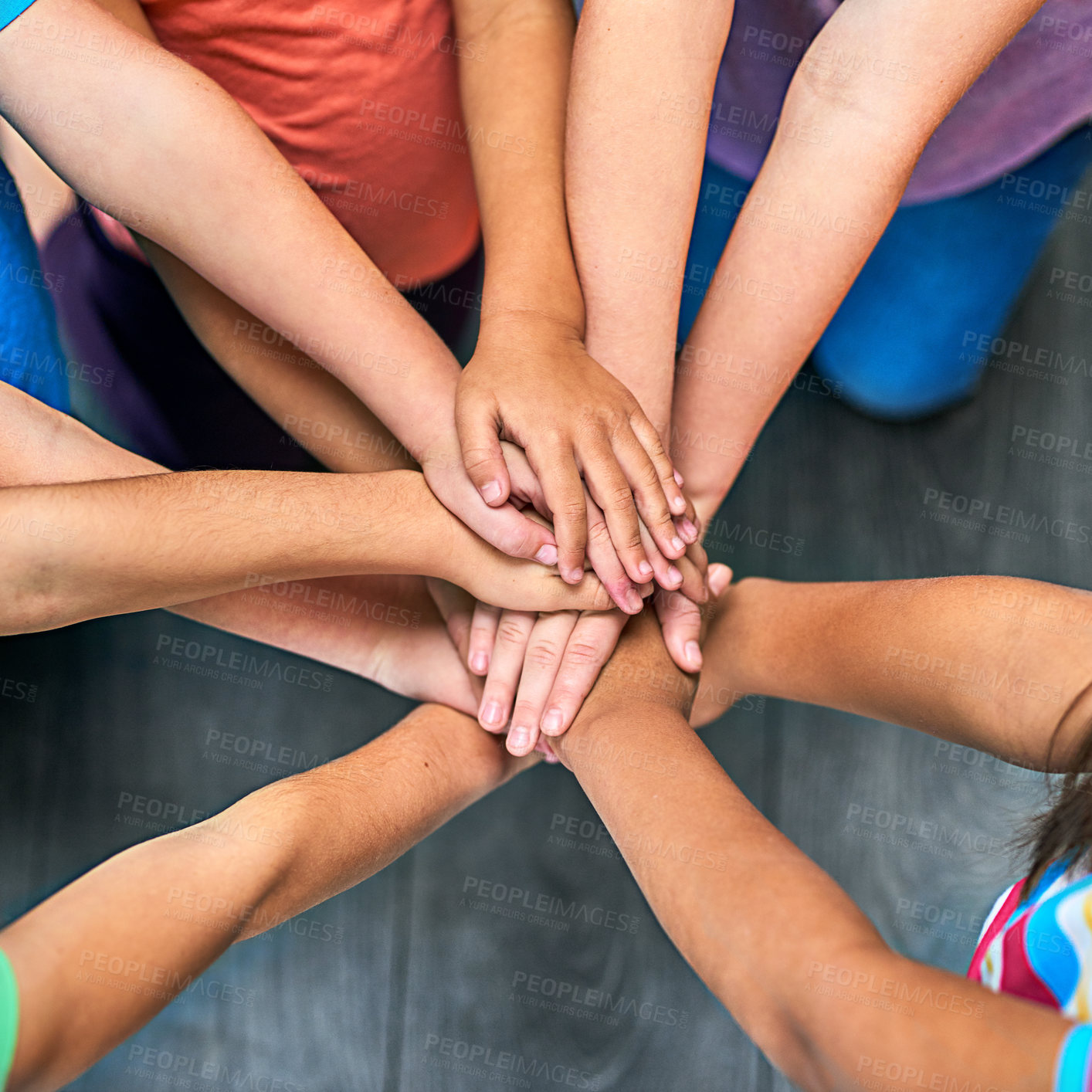 Buy stock photo Children, hands and together for solidarity, trust and achievement for growth in education. Students, kids and school for teamwork, support and development with huddle for commitment by above