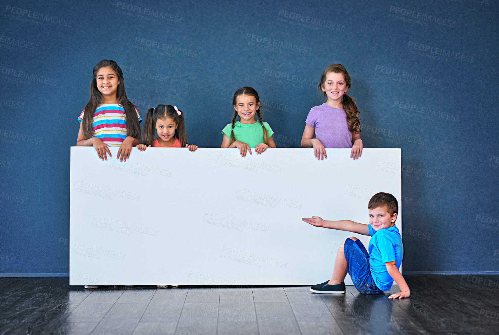 Buy stock photo Children, happy and portrait for placard, advertising and marketing discount with mockup space. People, smile and face on blue background for banner, branding and announcement with promo information