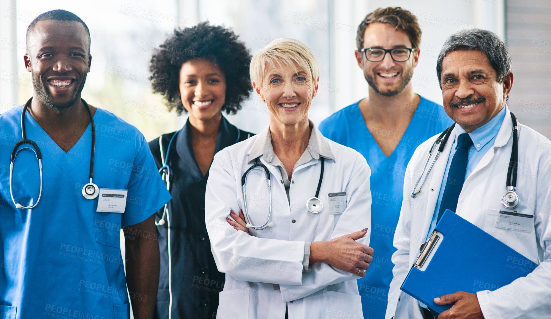 Buy stock photo Team or group of a doctor, nurse and medical professional colleagues or coworkers standing in a hospital together. Portrait of diverse healthcare workers looking confident and happy about medicine