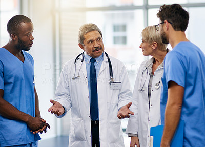 Buy stock photo Doctors talk, brainstorm and plan together to collaborate and discuss medical procedures in a hospital. Health professional colleagues consult and working together in a meeting while sharing ideas 