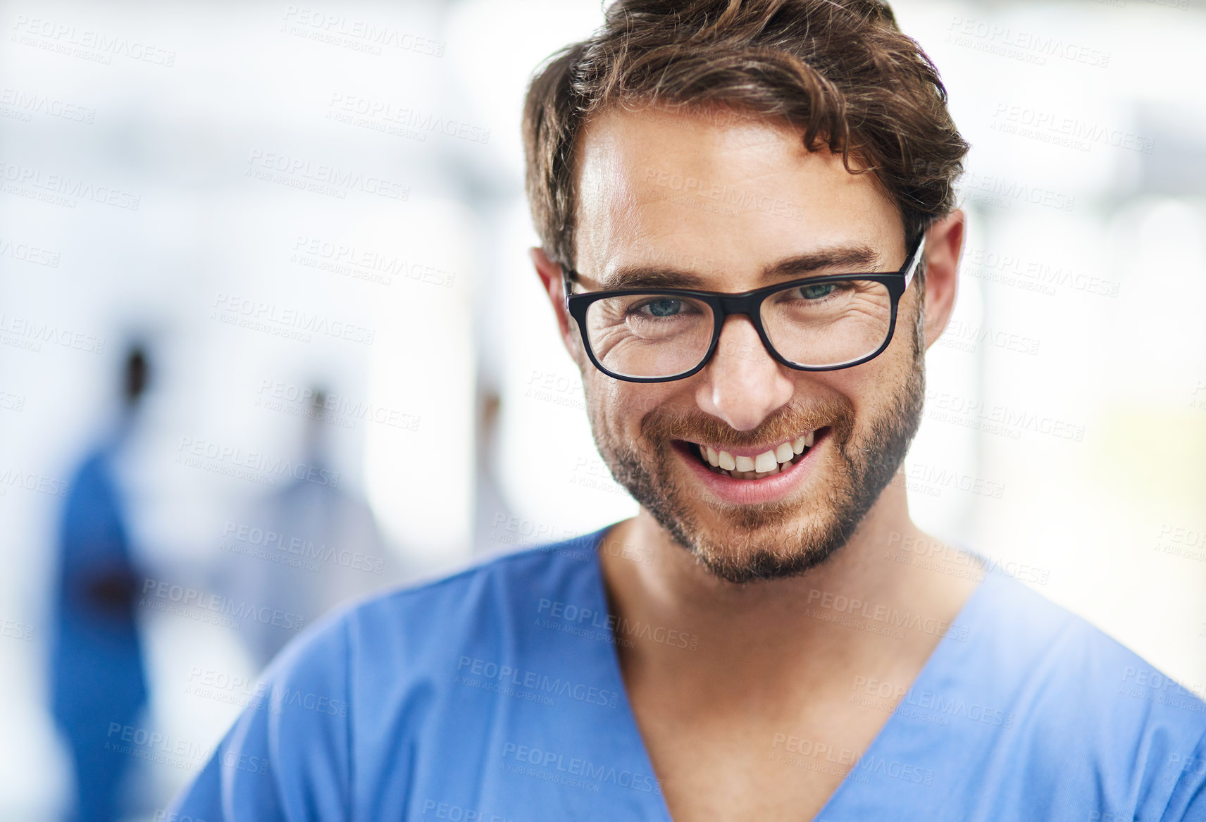 Buy stock photo Portrait of a happy young man working as a surgeon in a hospital