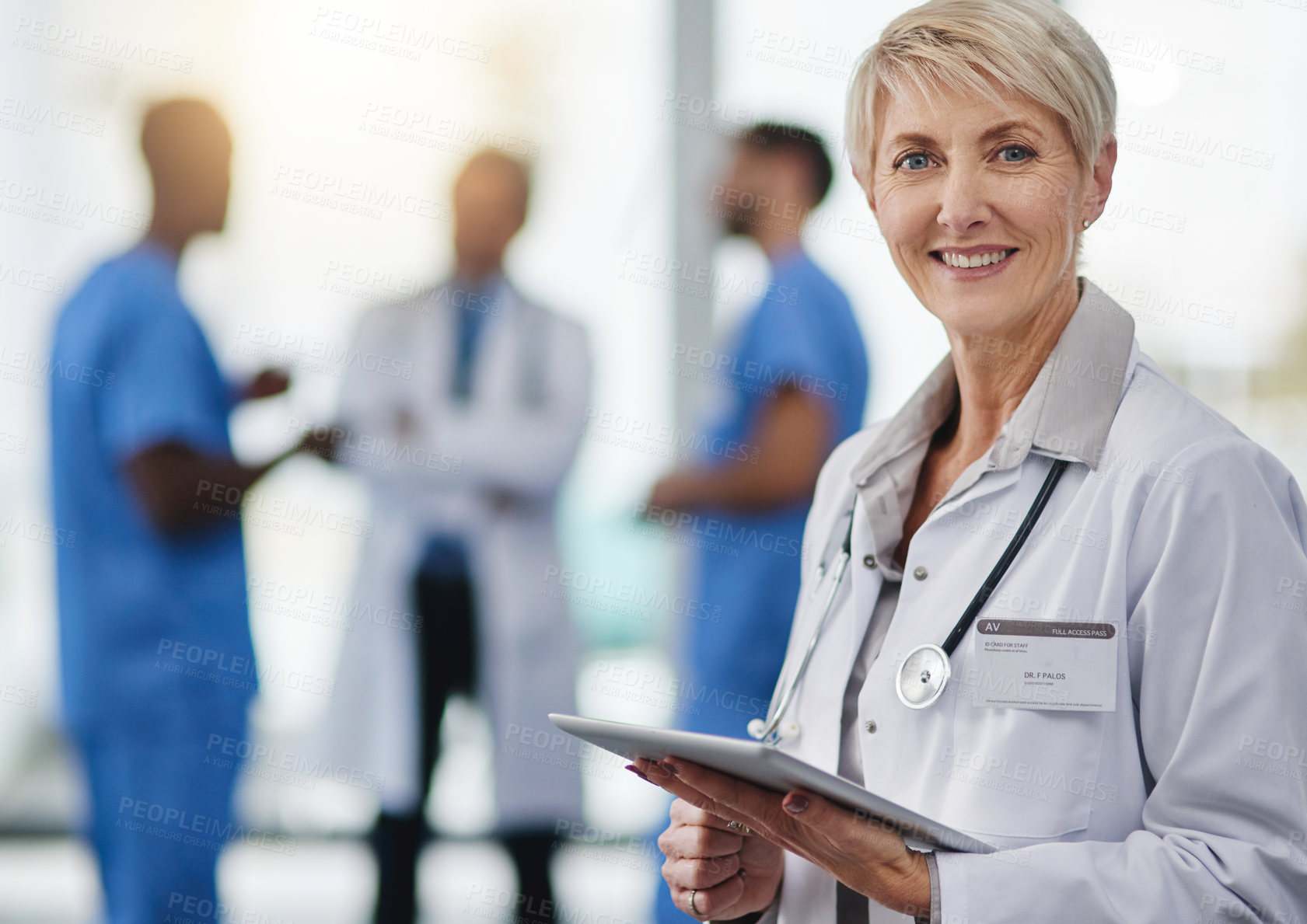 Buy stock photo Old female healthcare professional smiling and satisfied with telehealth on a tablet. Contact us for answers to your questions, FAQ or insurance doctor using the internet on a tablet. 