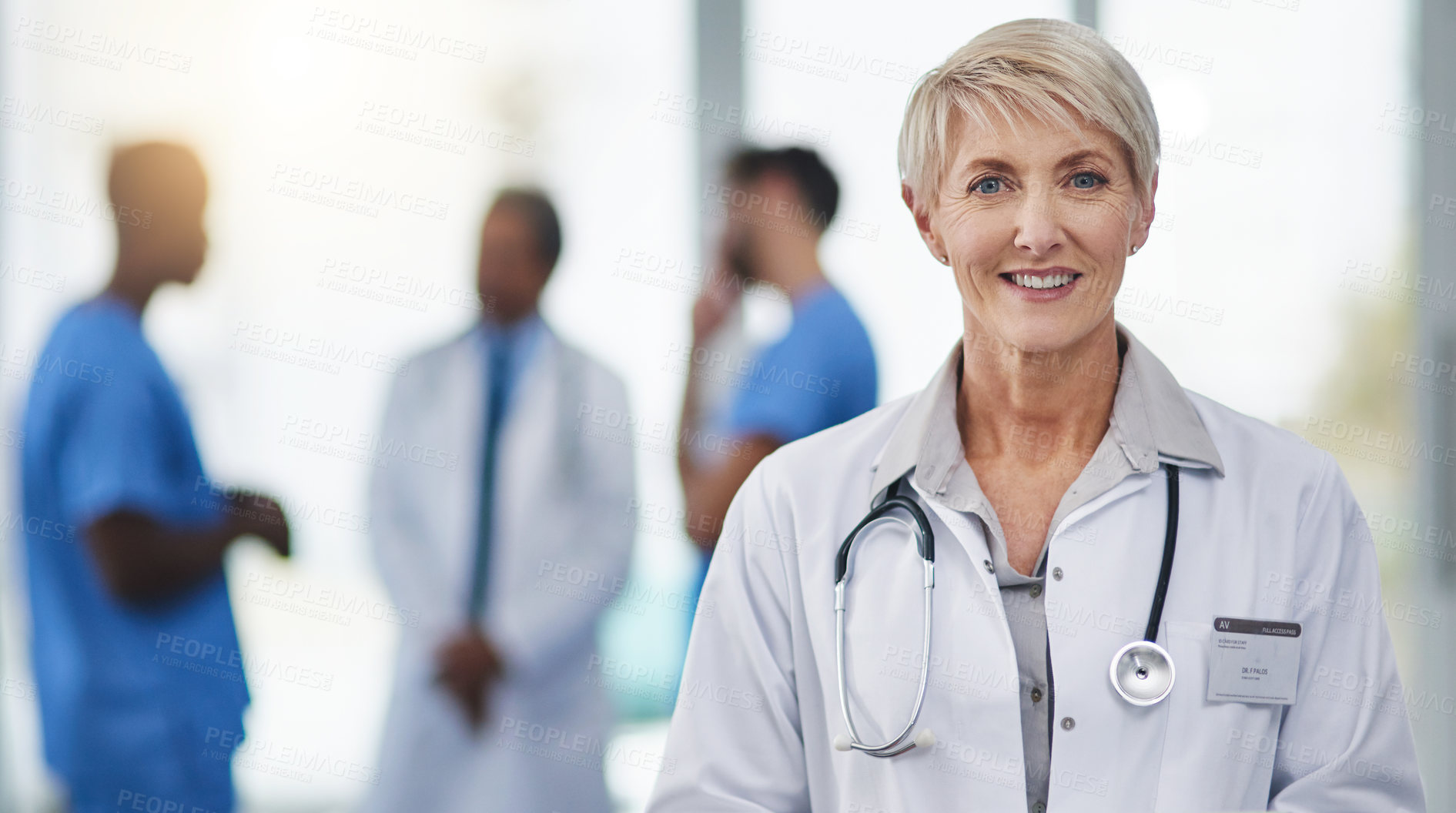 Buy stock photo Portrait of a happy mature woman working as a doctor in a hospital