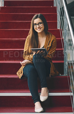 Buy stock photo Full length portrait of an attractive young university student studying while sitting on a staircase on campus