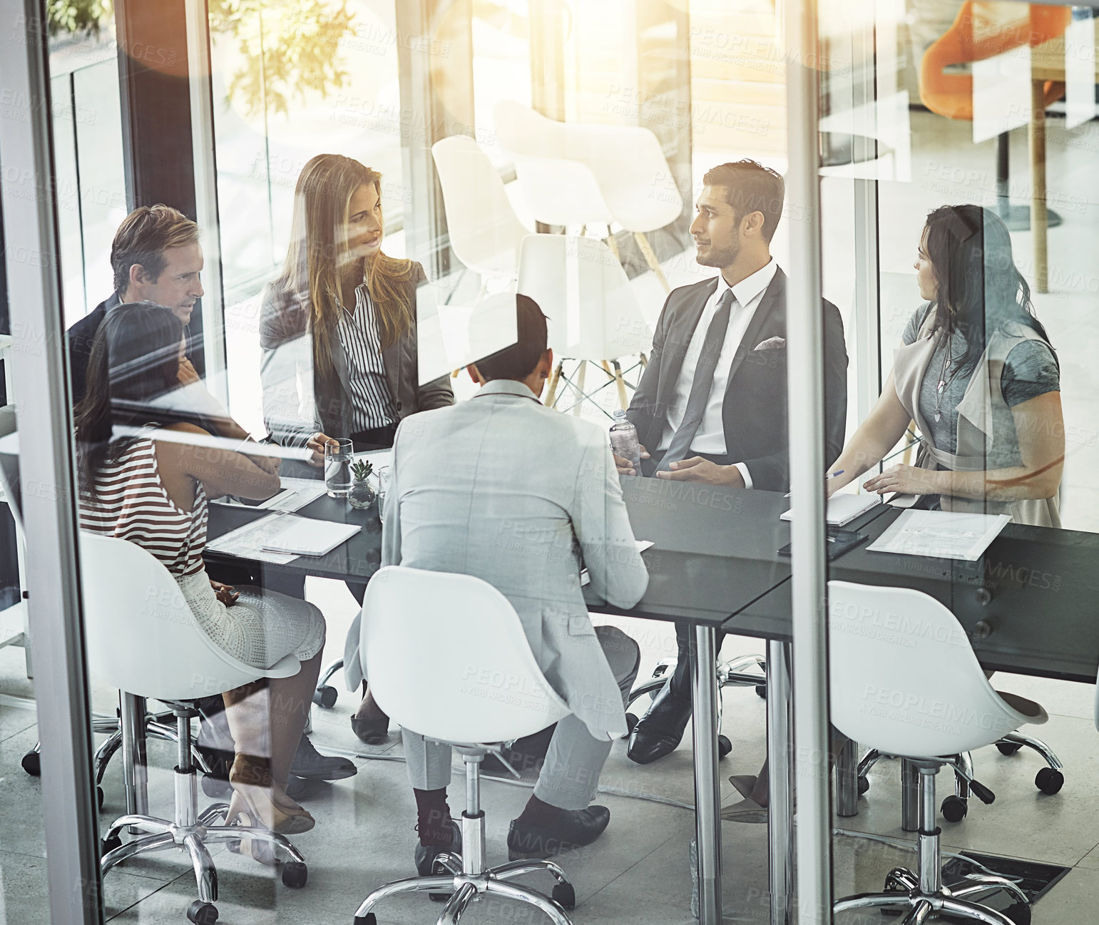 Buy stock photo Shot of corporate businesspeople meeting in the boardroom