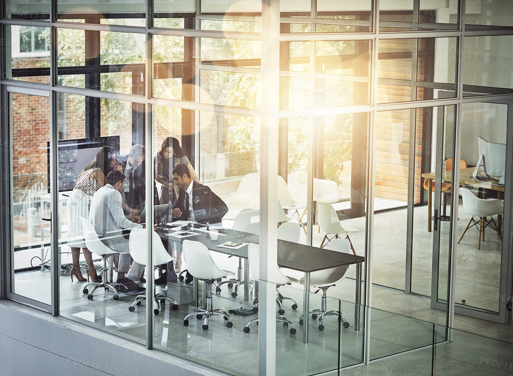 Buy stock photo Shot of corporate businesspeople meeting in the boardroom