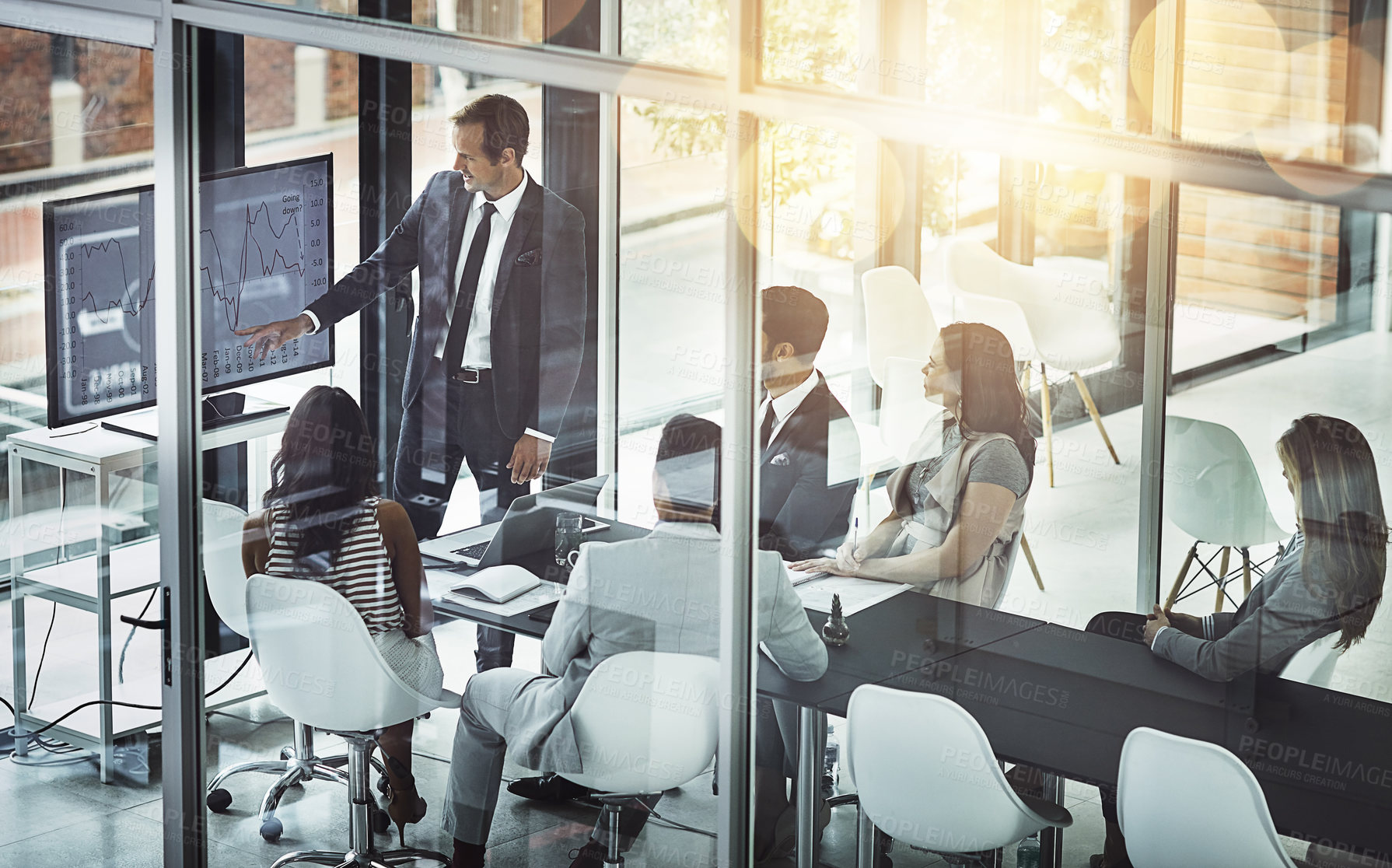 Buy stock photo Shot of a businessman delivering a presentation to coworkers in the boardroom