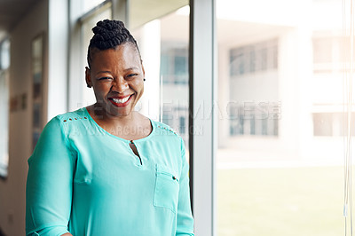 Buy stock photo Portrait of a successful mature businesswoman working in an office