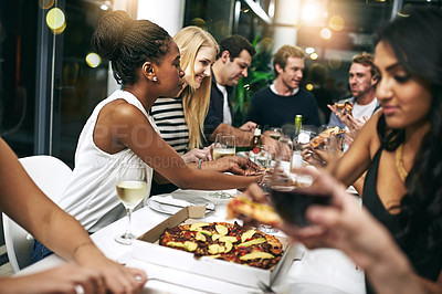Buy stock photo Food, party and pizza with friends at restaurant for celebration, wine and social event. Happy, diversity and night with group of people eating together for hungry, luxury and free time