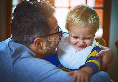 Buy stock photo Cropped shot of a single father holding his son at home