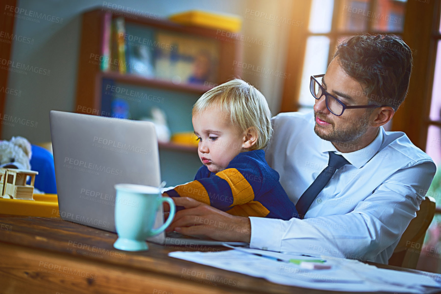 Buy stock photo Happy man, child and laptop as remote worker for love or support in family home as single parent. Male person, boy and tech for games, bonding and play in lounge for affection, growth and development