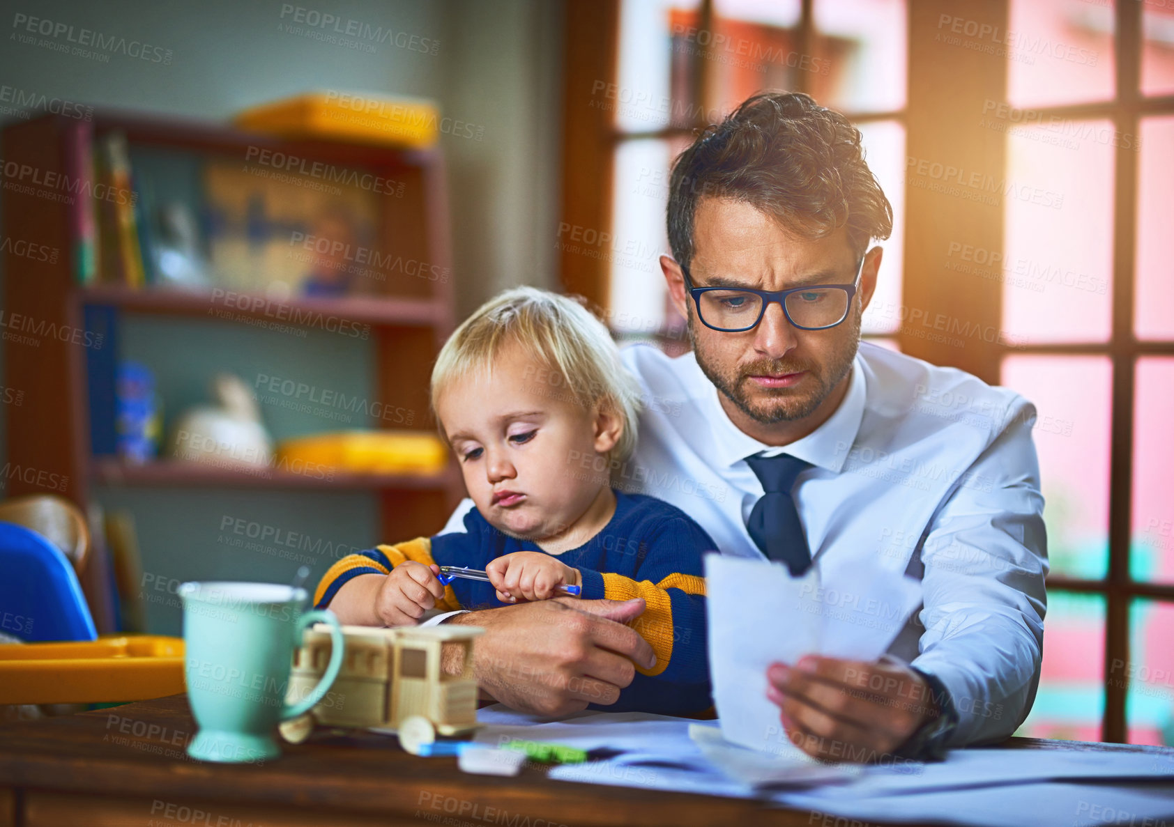 Buy stock photo Man, kid and paperwork as remote worker with stress or anxiety in family home as single parent. Male person, boy and documents for bills, mortgage and payment for childcare in finance or accounting