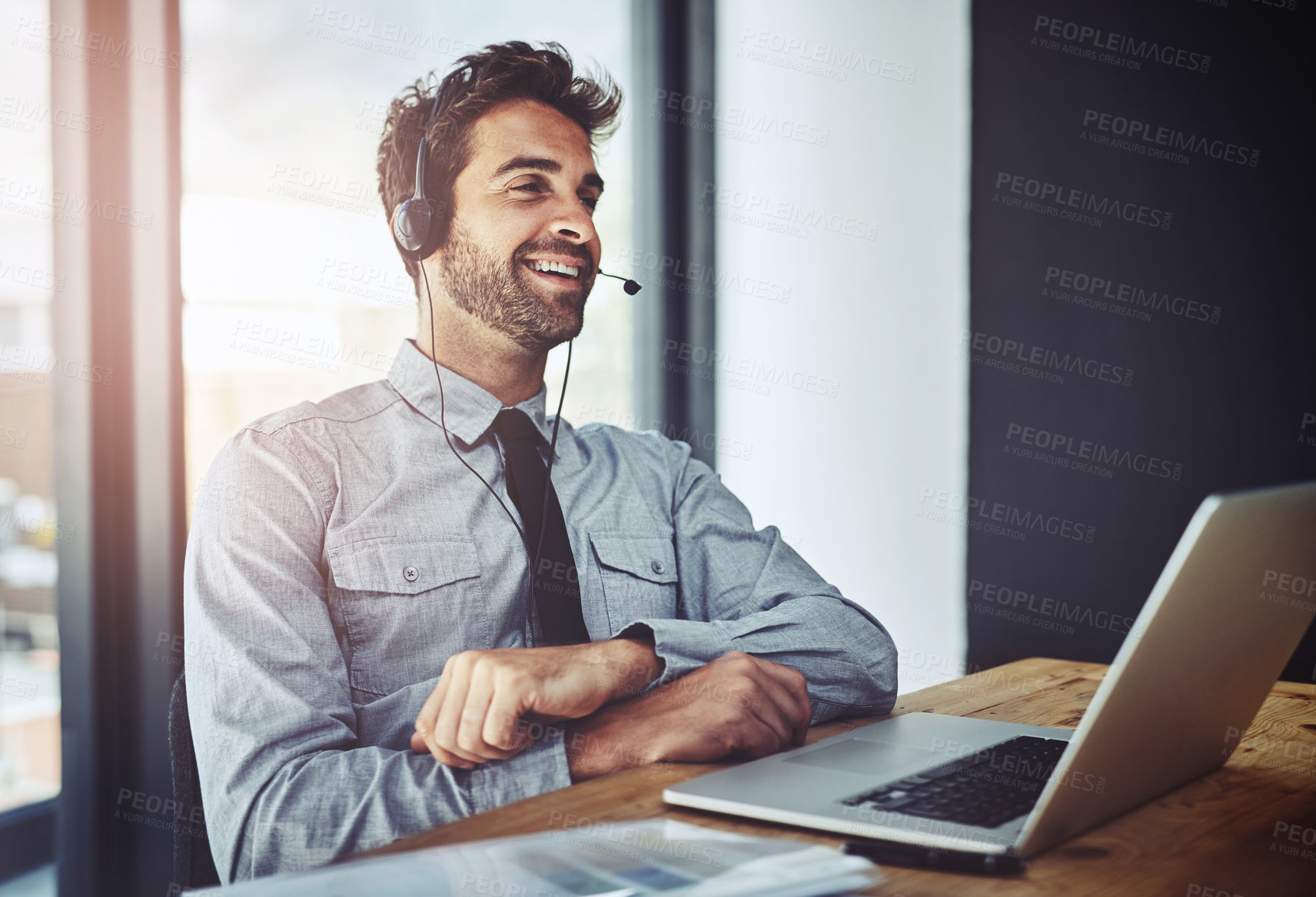 Buy stock photo Man, call center and laptop for listening in office, help desk or talking for telemarketing job. Consultant, agent and crm with customer service, tech support or telecom with headphones, mic and job