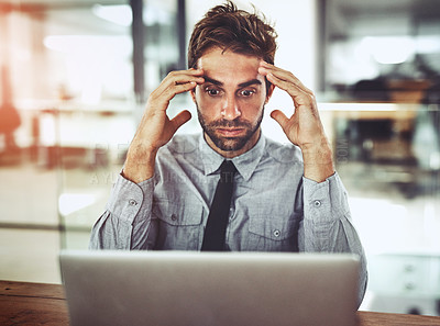 Buy stock photo Businessman, laptop and headache in stress, anxiety or burnout in shock from debt at office desk. Frustrated man person or employee with bad head pain or overworked in financial crisis at workplace