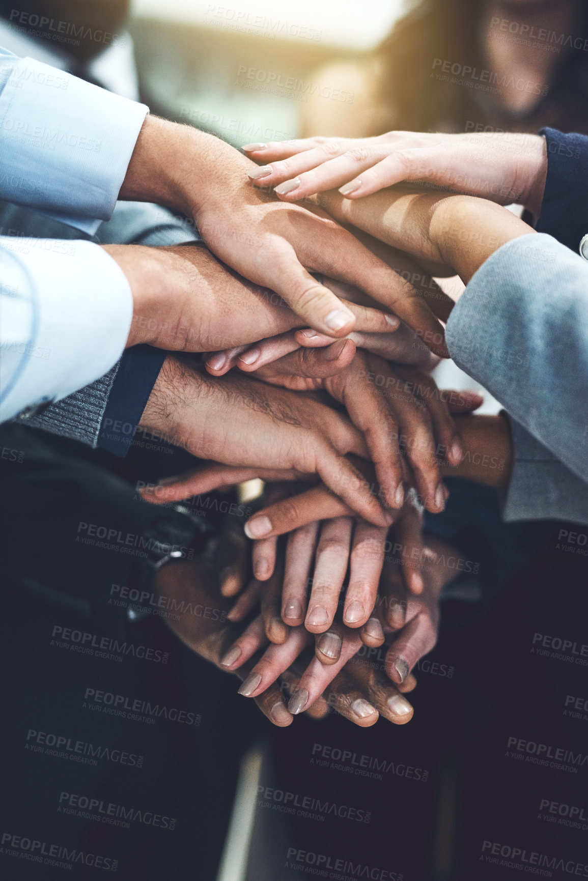 Buy stock photo Closeup shot of a group of businesspeople joining their hands together in unity