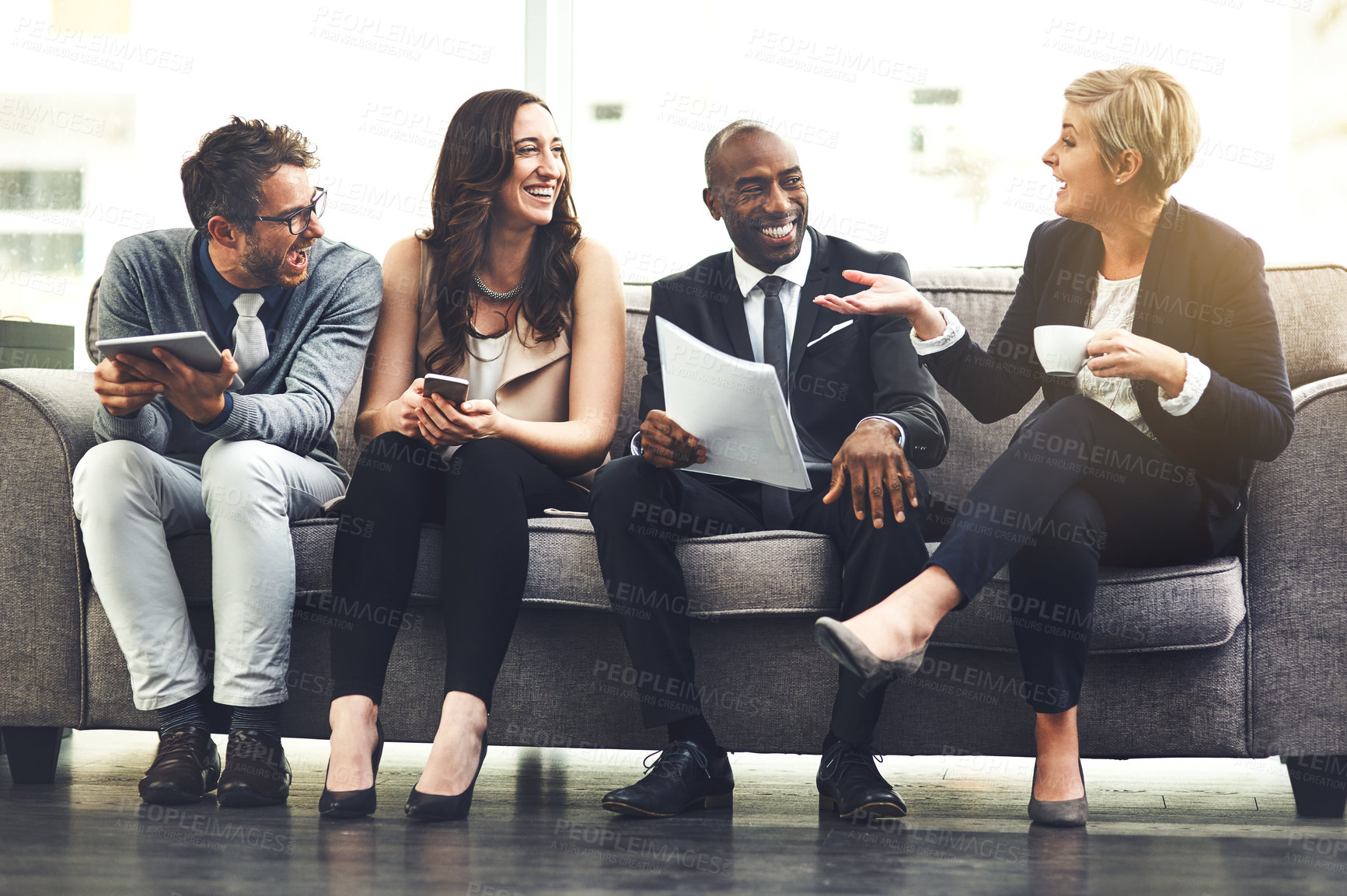 Buy stock photo Shot of a group of businesspeople brainstorming together in an office