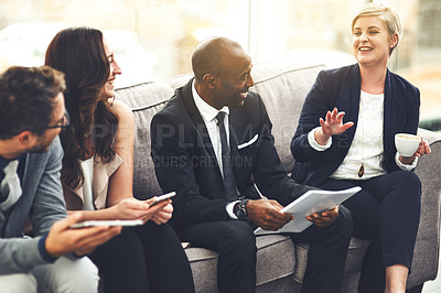 Buy stock photo Shot of a group of businesspeople brainstorming together in an office