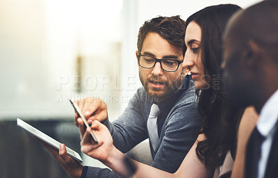 Buy stock photo Shot of a group of businesspeople brainstorming together in an office