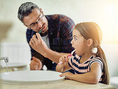 Buy stock photo Child, father and brushing teeth in bathroom, bonding and cleaning together. Dad, girl and toothbrush for dental hygiene, oral wellness or healthy tooth for family care, teaching and learning in home