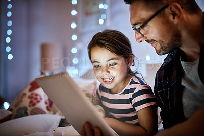 Buy stock photo Father, daughter and tablet in bedroom at night for reading, storytelling and learning on website or ebook app. Child, family and dad or man on digital tech at home for paperless education or bonding