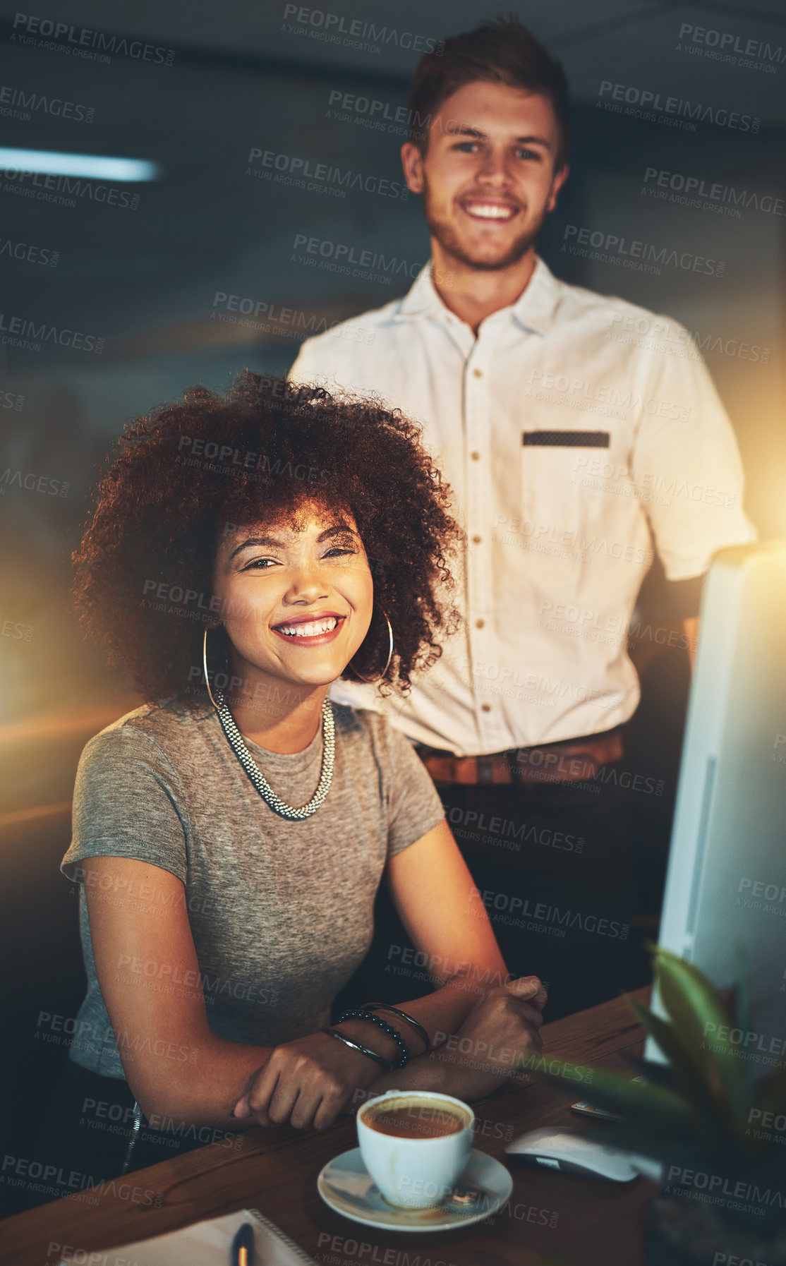 Buy stock photo Cropped shot of young employees working late into the evening