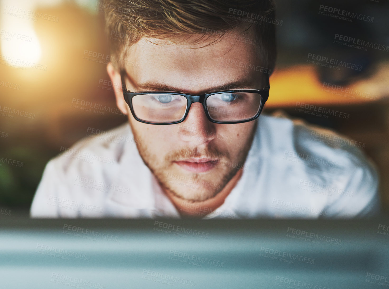 Buy stock photo Man, computer and glasses at night in office, research and web designer for proposal. Male person, employee and reading or website for online tasks, project management and reflection on late shift