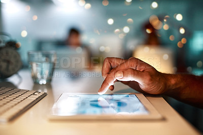 Buy stock photo Cropped shot of an unrecognizable person using a digital tablet at a office