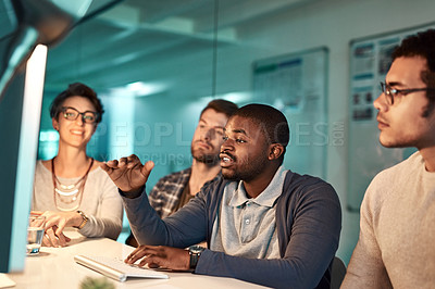 Buy stock photo Shot of diverse colleagues working late at the office