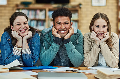 Buy stock photo Portrait of a group of university students sitting in the library at campus