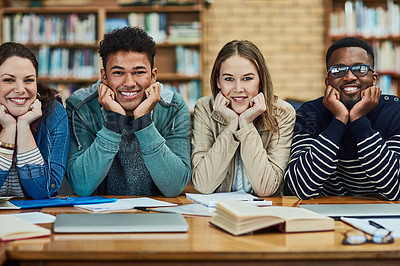 Buy stock photo Portrait of a group of university students sitting in the library at campus