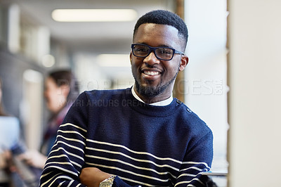 Buy stock photo Portrait of a university student standing in a corridor at campus