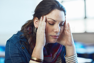 Buy stock photo Shot of a university student looking stressed out at campus