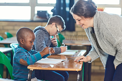 Buy stock photo Cropped shot of elementary school kids being taught in the classroom