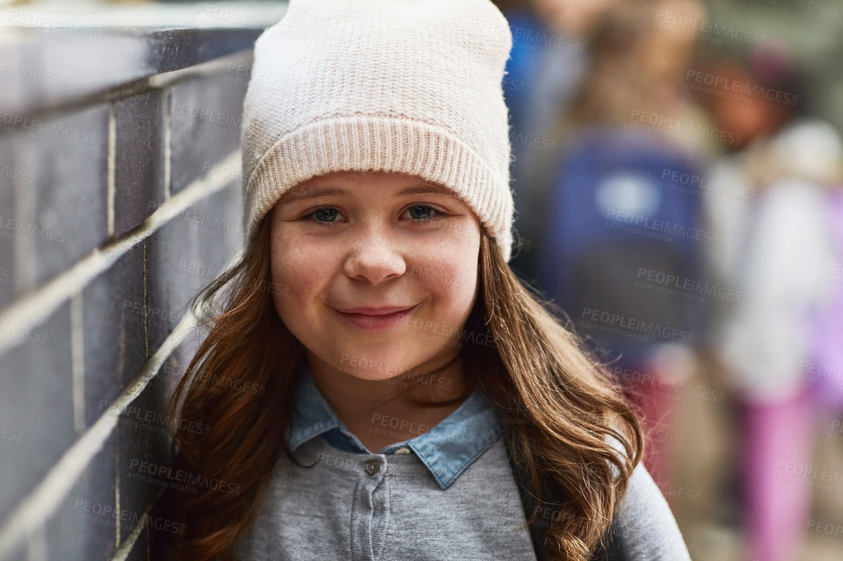 Buy stock photo School, corridor and portrait of girl with smile for academy education, knowledge and child development. Happy, face and student with beanie in hallway for morning, scholarship and growth in learning