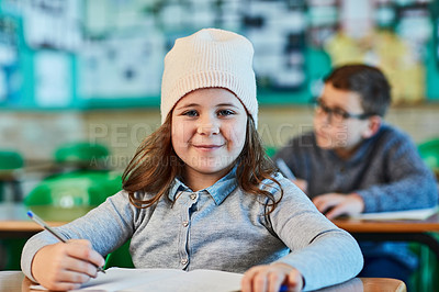 Buy stock photo Cropped shot of an elementary school girl in the classroom