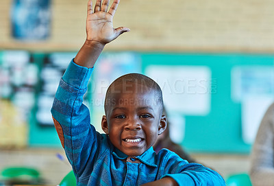 Buy stock photo Cropped shot of an elementary school boy hand raised in the classroom