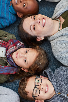 Buy stock photo School, portrait and kids on floor with teacher for support, happy education and diversity with child development. Face, woman and children on carpet in classroom with smile, learning and students