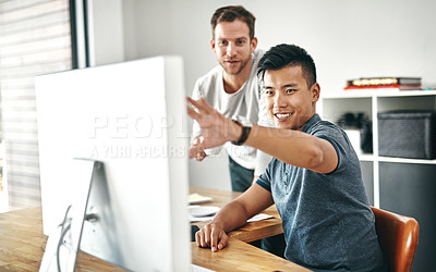 Buy stock photo Cropped shot of two designers working together on a project in an office
