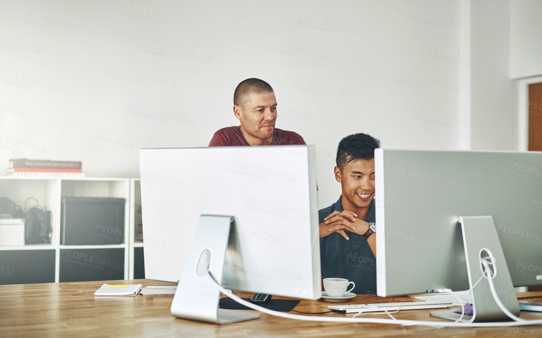 Buy stock photo Cropped shot of two designers working together on a project in an office